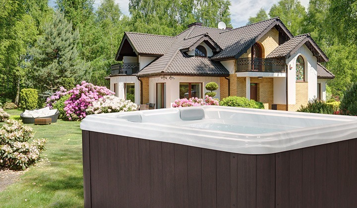 A Garden Spa Hot Tub in front of a house