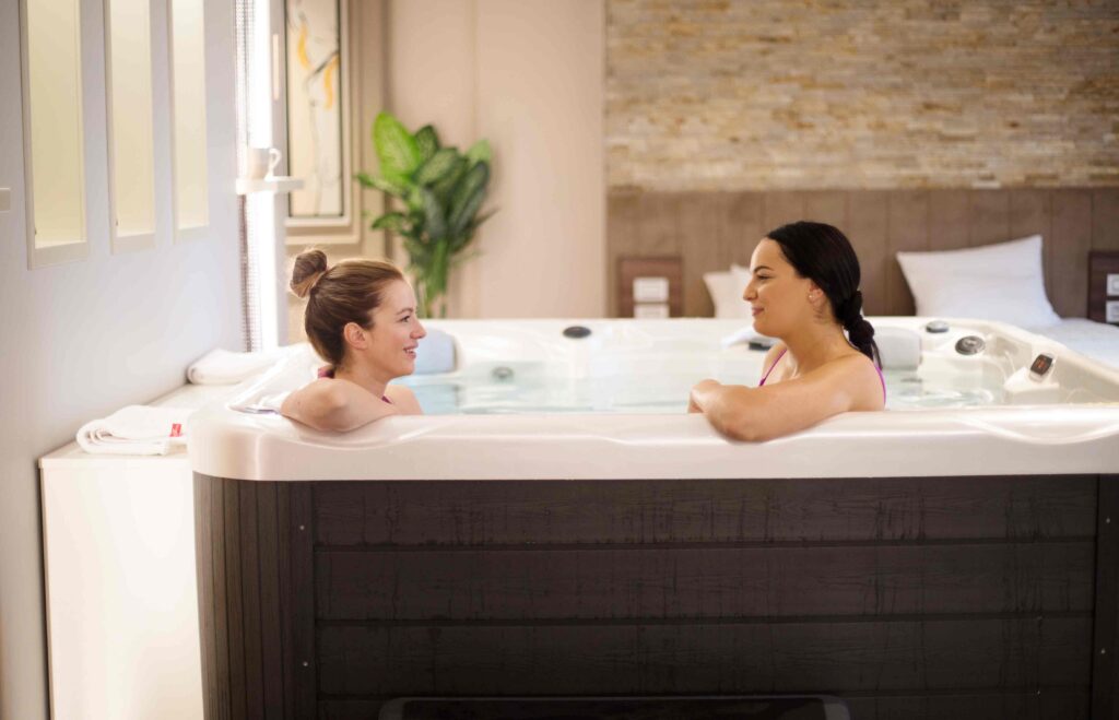 What you need to know before buying a spa- Two people in a spa