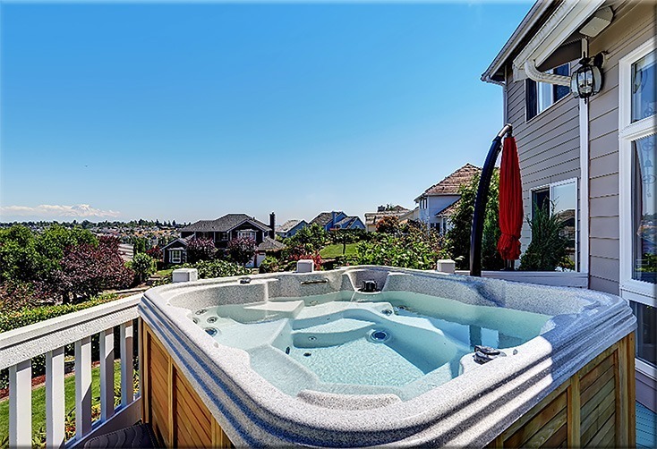A hot tub on a second story porch